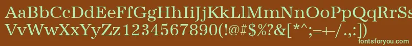 フォントUrwantiquat – 緑色の文字が茶色の背景にあります。