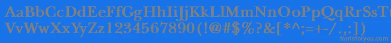 NewbaskervilleBold-fontti – harmaat kirjasimet sinisellä taustalla