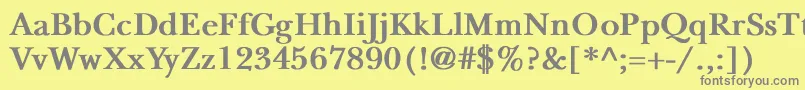 NewbaskervilleBold-fontti – harmaat kirjasimet keltaisella taustalla