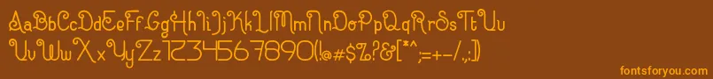 フォントEugiene – オレンジ色の文字が茶色の背景にあります。