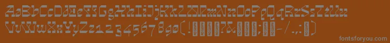 Cosmosskrift-fontti – harmaat kirjasimet ruskealla taustalla