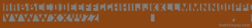 Namafont-fontti – harmaat kirjasimet ruskealla taustalla