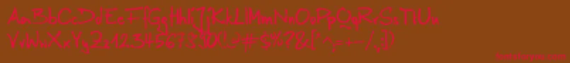 AnilinRegular-Schriftart – Rote Schriften auf braunem Hintergrund