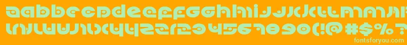 Kovacsspotexpand-Schriftart – Grüne Schriften auf orangefarbenem Hintergrund