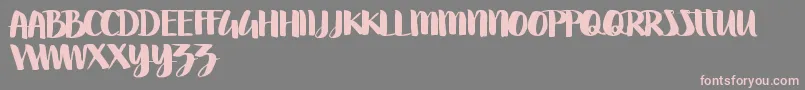Swettiest-Schriftart – Rosa Schriften auf grauem Hintergrund