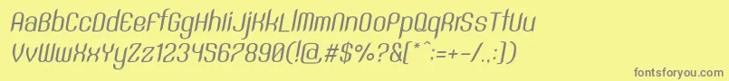 SntAnouvongRegularItalic-fontti – harmaat kirjasimet keltaisella taustalla