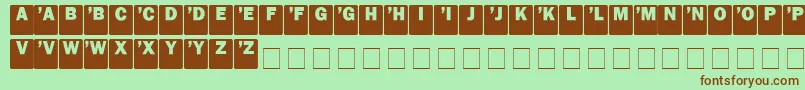 DcSans-fontti – ruskeat fontit vihreällä taustalla