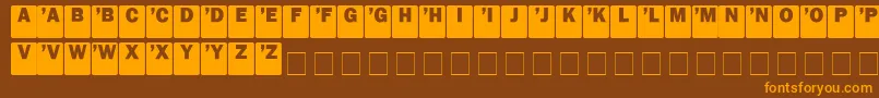DcSans-fontti – oranssit fontit ruskealla taustalla