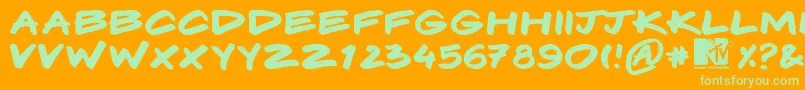 フォントKomix – オレンジの背景に緑のフォント