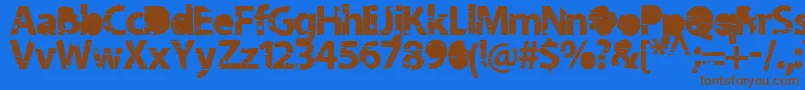 フォントTramyad – 茶色の文字が青い背景にあります。