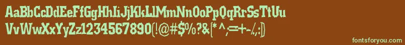 フォントRatmanbane – 緑色の文字が茶色の背景にあります。