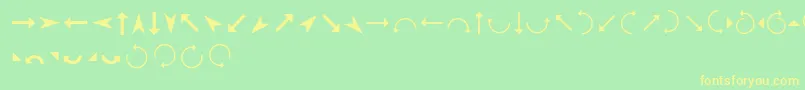 フォントArrows – 黄色の文字が緑の背景にあります