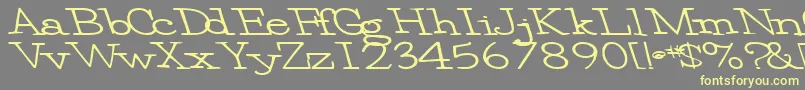 フォントEggbeater86Bold – 黄色のフォント、灰色の背景