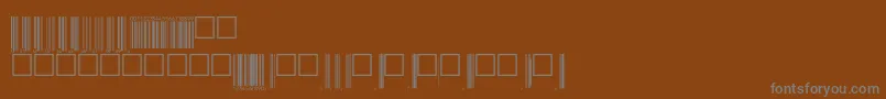 V200001-fontti – harmaat kirjasimet ruskealla taustalla