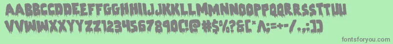 Zombiecontrolrotate-Schriftart – Graue Schriften auf grünem Hintergrund