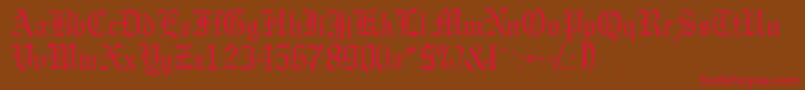 フォントGargoylessk – 赤い文字が茶色の背景にあります。
