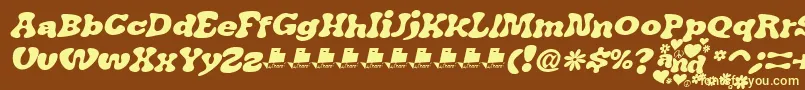JAirplaneSwashItalicFont-fontti – keltaiset fontit ruskealla taustalla