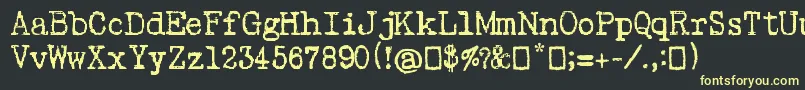 フォントPsacstroj – 黒い背景に黄色の文字
