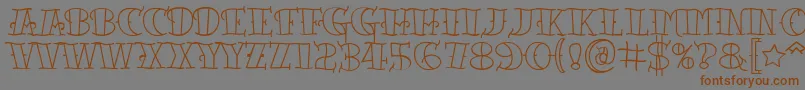 Tattooletteringopen-Schriftart – Braune Schriften auf grauem Hintergrund