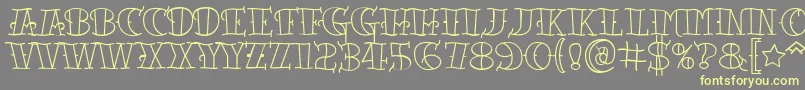 Tattooletteringopen Font – Yellow Fonts on Gray Background