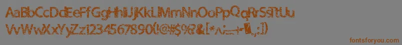 フォントQuickcut – 茶色の文字が灰色の背景にあります。