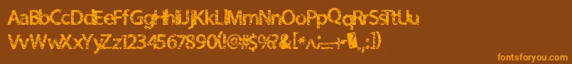 フォントQuickcut – オレンジ色の文字が茶色の背景にあります。
