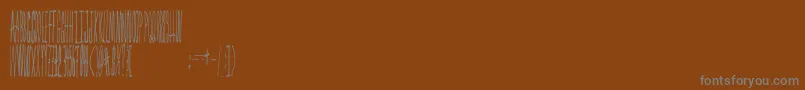 Czcionka Forestfire – szare czcionki na brązowym tle