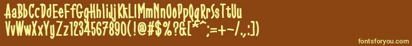 Gobbledegook-fontti – keltaiset fontit ruskealla taustalla