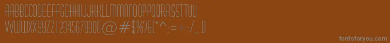 フォントAHuxleyrough – 茶色の背景に灰色の文字