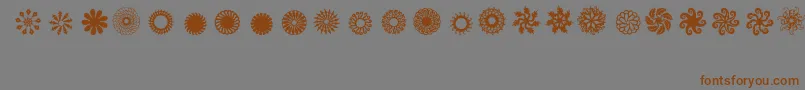 フォントLadoodles8 – 茶色の文字が灰色の背景にあります。