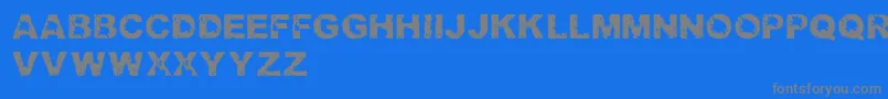 TrashedlightRegular-fontti – harmaat kirjasimet sinisellä taustalla