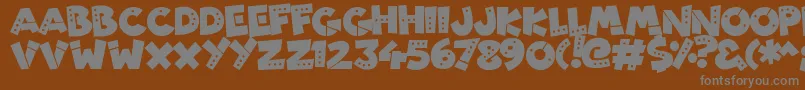 PatchyRobots-fontti – harmaat kirjasimet ruskealla taustalla