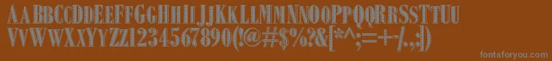 Squealpiggy-Schriftart – Graue Schriften auf braunem Hintergrund