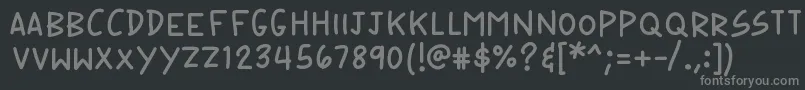 K26speechbubble-fontti – harmaat kirjasimet mustalla taustalla