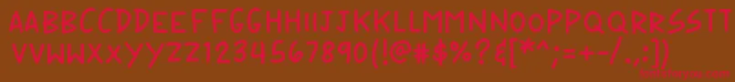 フォントK26speechbubble – 赤い文字が茶色の背景にあります。