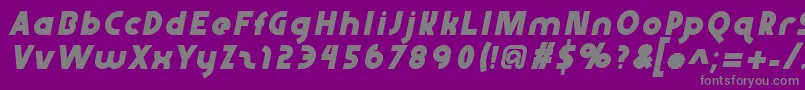 Abraxeousitalic-fontti – harmaat kirjasimet violetilla taustalla