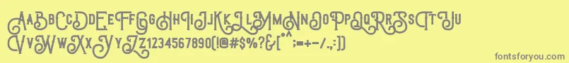 TriumphWheelsRough-Schriftart – Graue Schriften auf gelbem Hintergrund