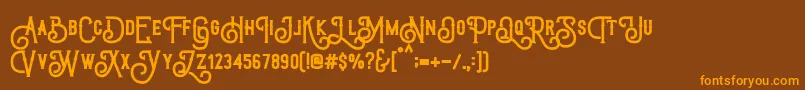 TriumphWheelsRough-Schriftart – Orangefarbene Schriften auf braunem Hintergrund