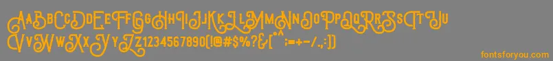 TriumphWheelsRough-Schriftart – Orangefarbene Schriften auf grauem Hintergrund
