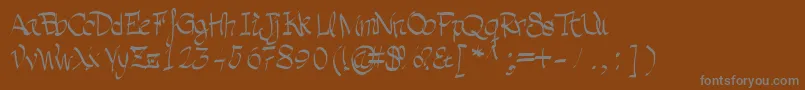 Grafia-fontti – harmaat kirjasimet ruskealla taustalla