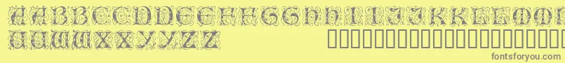 Illuminatitwodisplaycapsssk-Schriftart – Graue Schriften auf gelbem Hintergrund