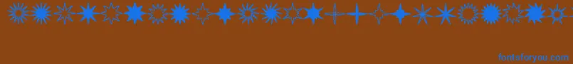 StarsSplatsArrows Font – Blue Fonts on Brown Background