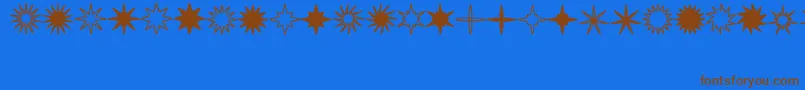 StarsSplatsArrows Font – Brown Fonts on Blue Background