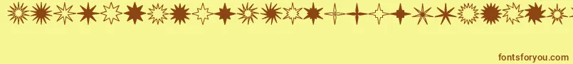 StarsSplatsArrows Font – Brown Fonts on Yellow Background