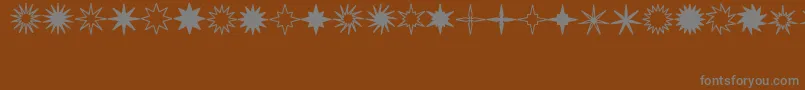 Шрифт StarsSplatsArrows – серые шрифты на коричневом фоне