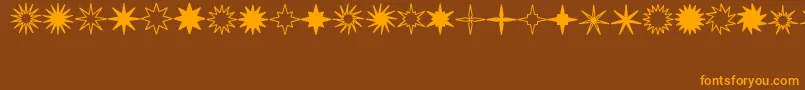 StarsSplatsArrows Font – Orange Fonts on Brown Background