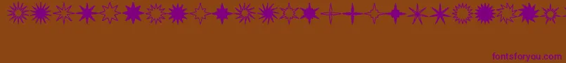 Fonte StarsSplatsArrows – fontes roxas em um fundo marrom