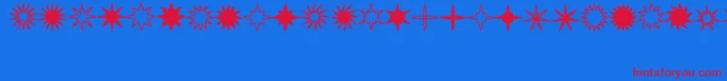 StarsSplatsArrows Font – Red Fonts on Blue Background