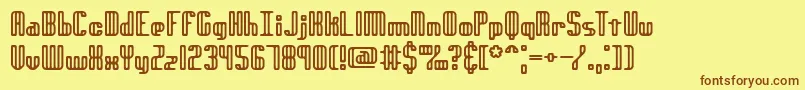 フォントGenotyrh – 茶色の文字が黄色の背景にあります。