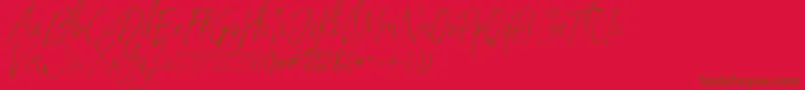 StronglovesFree-Schriftart – Braune Schriften auf rotem Hintergrund